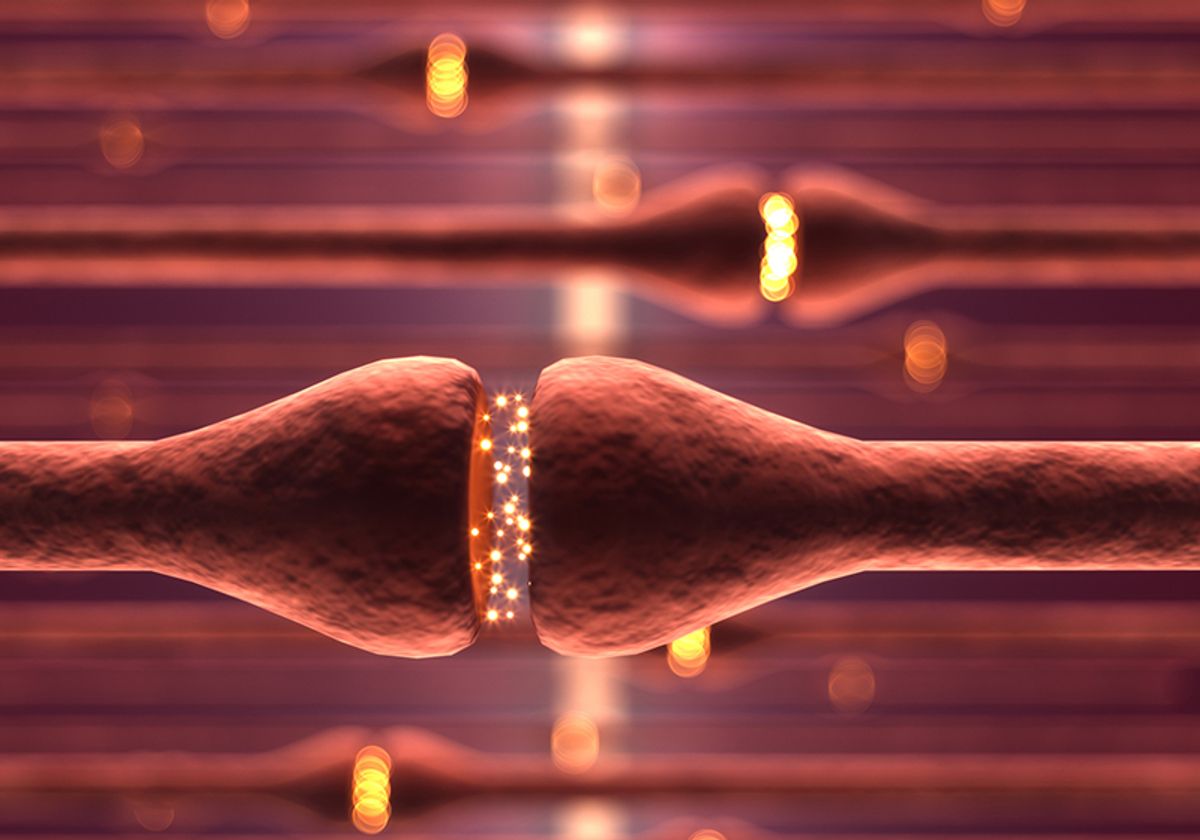 Conceptual image of synaptic activity between neurons, depicted by yellow glowing balls of light at the ends of red nerve cells.