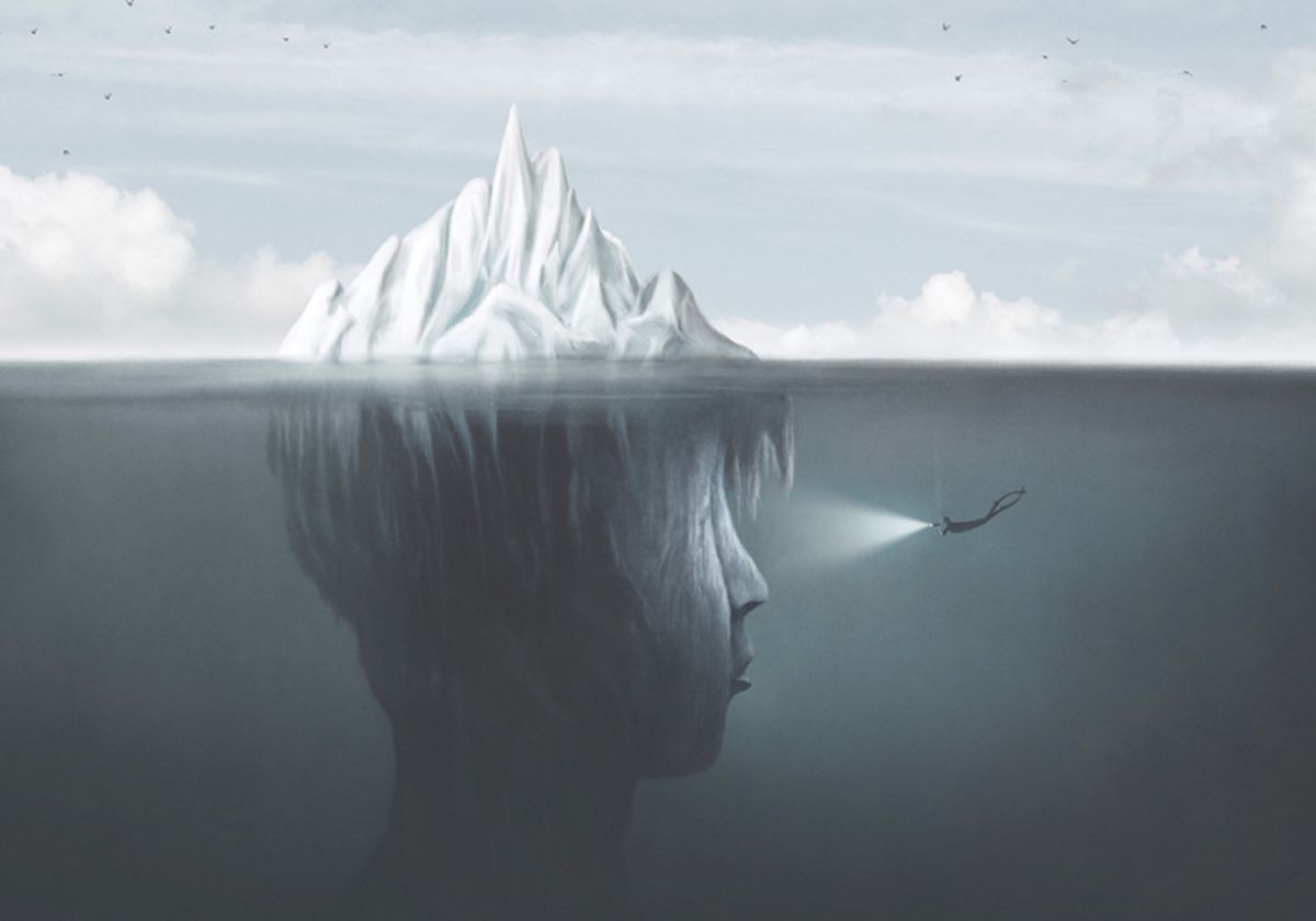 Surreal illustration of the mind, represented by a person-shaped iceberg. A scuba diver illuminates the dark side of the iceberg underwater with a flashlight.